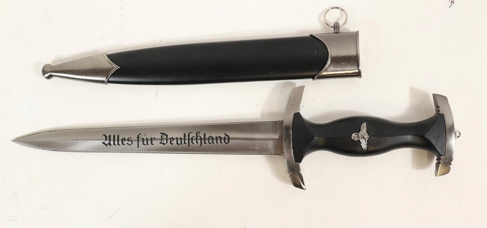 Decorative SS-Style Dagger w/ Etched Blade: Decorative dagger featuring a steel blade with acid-etched motto and maker's mark (RZM 941/37/SS on reverse). Ebonized wood grip with inlaid eagle and runic insignia, nickel cross guards, and