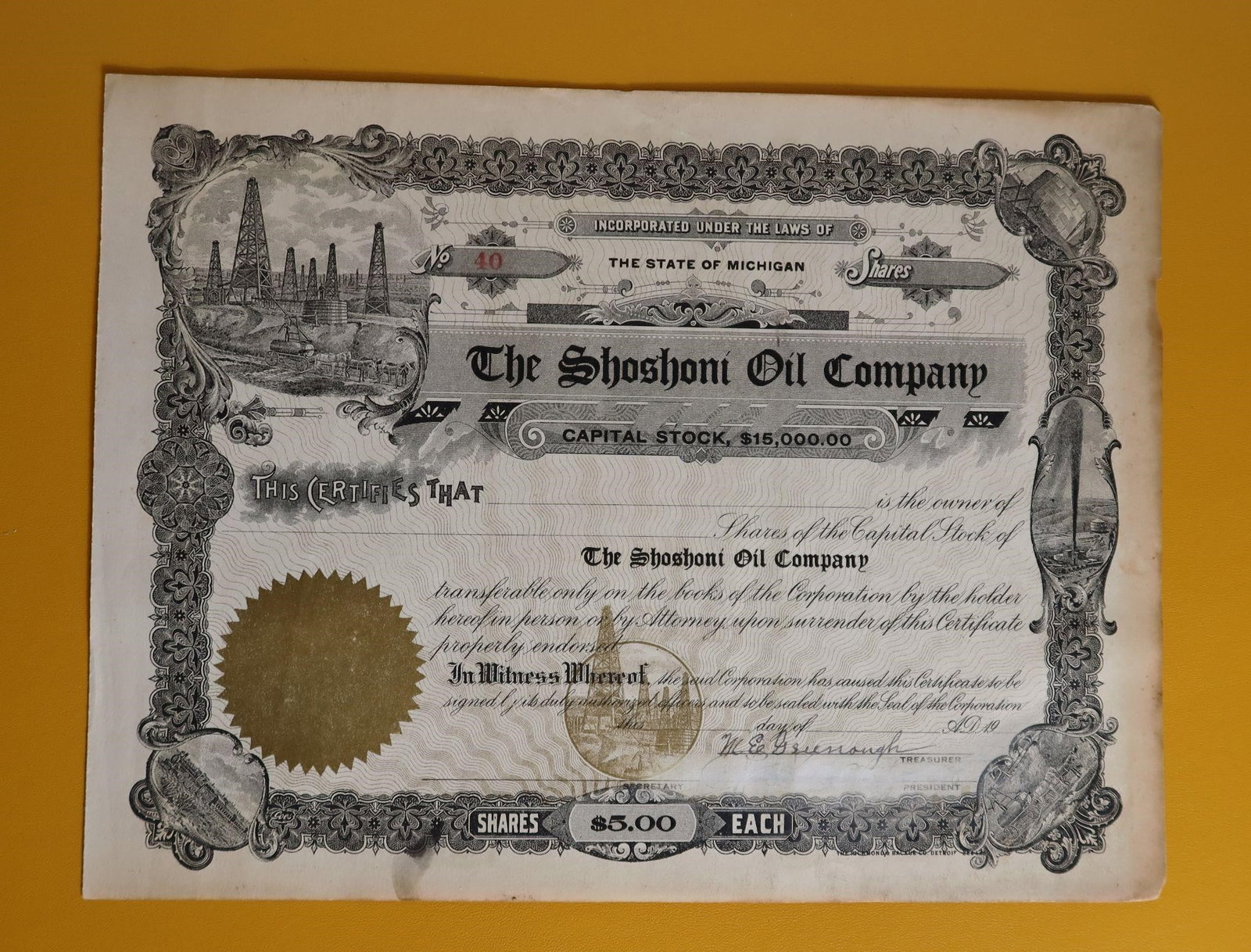 Vintage Shoshoni Oil Co. Stock Certificate: This is a vintage stock certificate for The Shoshoni Oil Company. The certificate indicates the company was incorporated under the laws of the State of Michigan with a capital stock of $15,000.00, wit