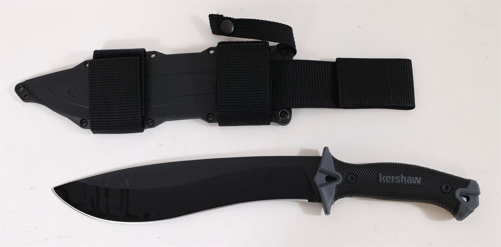 Kershaw Machete 10" Fixed Blade Knife Black: This Kershaw Camp 10 Machete Is A Rugged 10" Fixed Blade Knife Built For Outdoor And Survival Tasks Like Clearing Brush, Splitting Wood, And Prepping Kindling. Crafted From Tough 65mn Carbon Tool