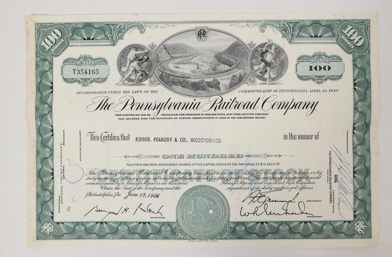 Pennsylvania Railroad Stock Certificate 1966: Vintage green Pennsylvania Railroad Company stock certificate for 100 shares, issued on June 13, 1966.