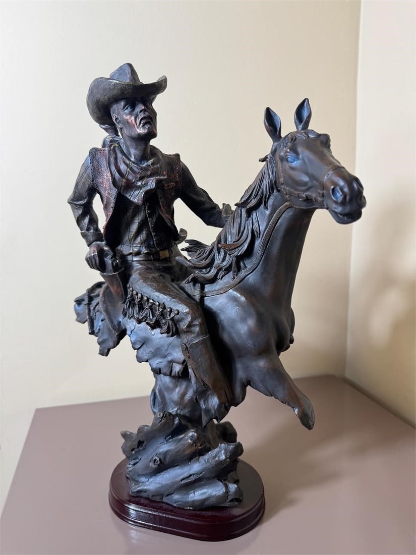 Bronco Buster Cowboy Sculpture: Bronco Buster Cowboy SculptureDimensions: H: 15in L: 10in W: 5in