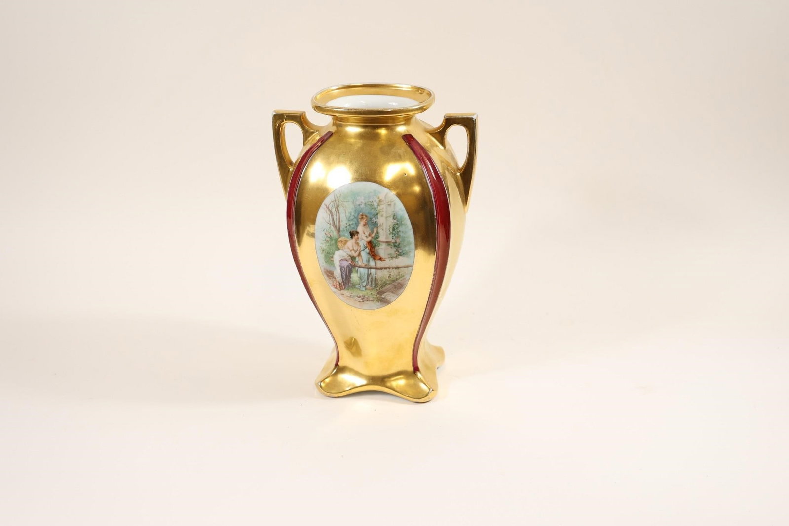 Antique Porcelain Cabinet Urn Vase: Antique porcelain cabinet urn vase in the style of Royal Vienna or similar European makers; features elegant form with decorative detailing, likely hand-painted, making it a refined collectible and