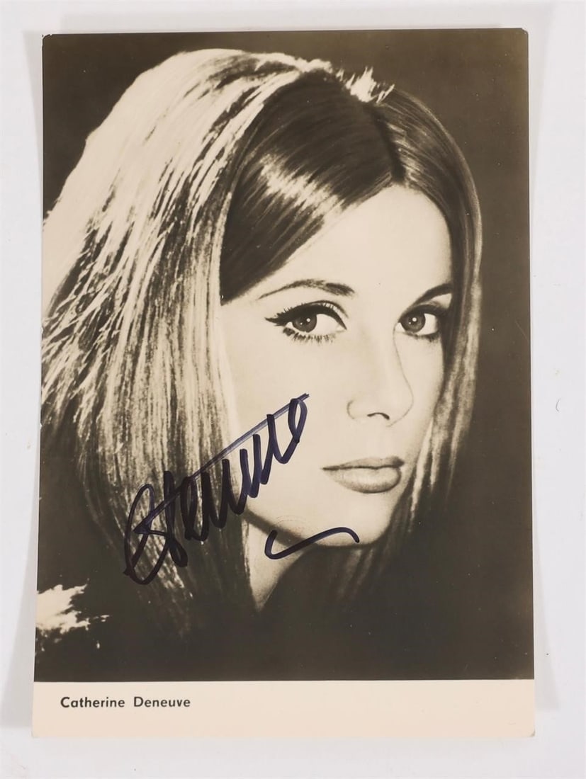 Catherine Deneuve Signed Progress Postcard: CATHERINE DENEUVE(French actress and film icon)A very old, original autograph card issued by PROGRESS Film-Verleih (Film Distribution) in Berlin, Archive No. 2522, featuring a scene from the feature