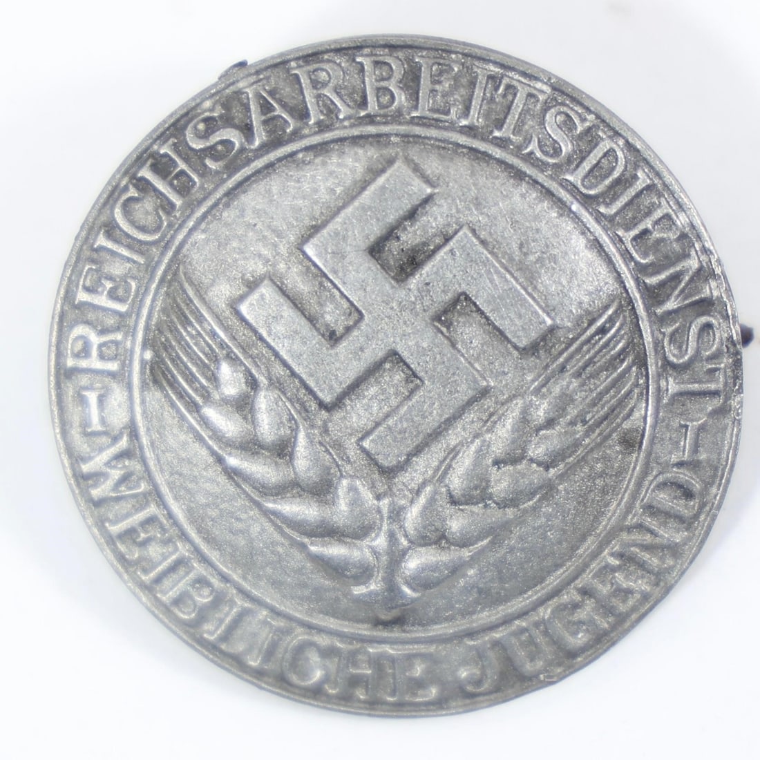 Vintage German Wound Badge Military Decoration: The item pictured is a vintage German military decoration, specifically a Wound Badge, which was awarded for wounds sustained in hostile action.
