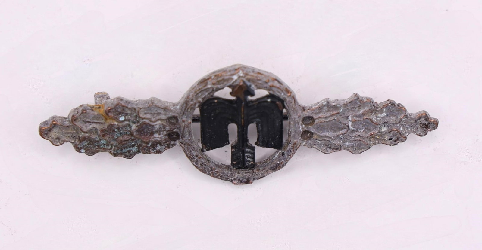 WWII Luftwaffe Day Fighter Clasp Silver Grade: This item is a Luftwaffe Day Fighter Clasp in Silver Grade, a WWII German military decoration awarded to fighter pilots and aircrew for operational service.