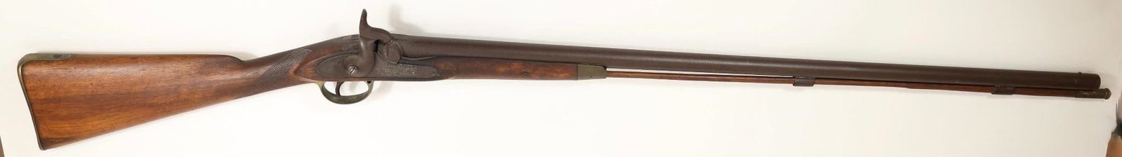 English Pre 98 Percussion Muzzle Loader: 50" OAL, brass trigger guard. Antique-style long gun featuring a wood stock with visible grain, dual barrel configuration, and metal fittings. Shows patina, wear, and handling consistent with age. A c