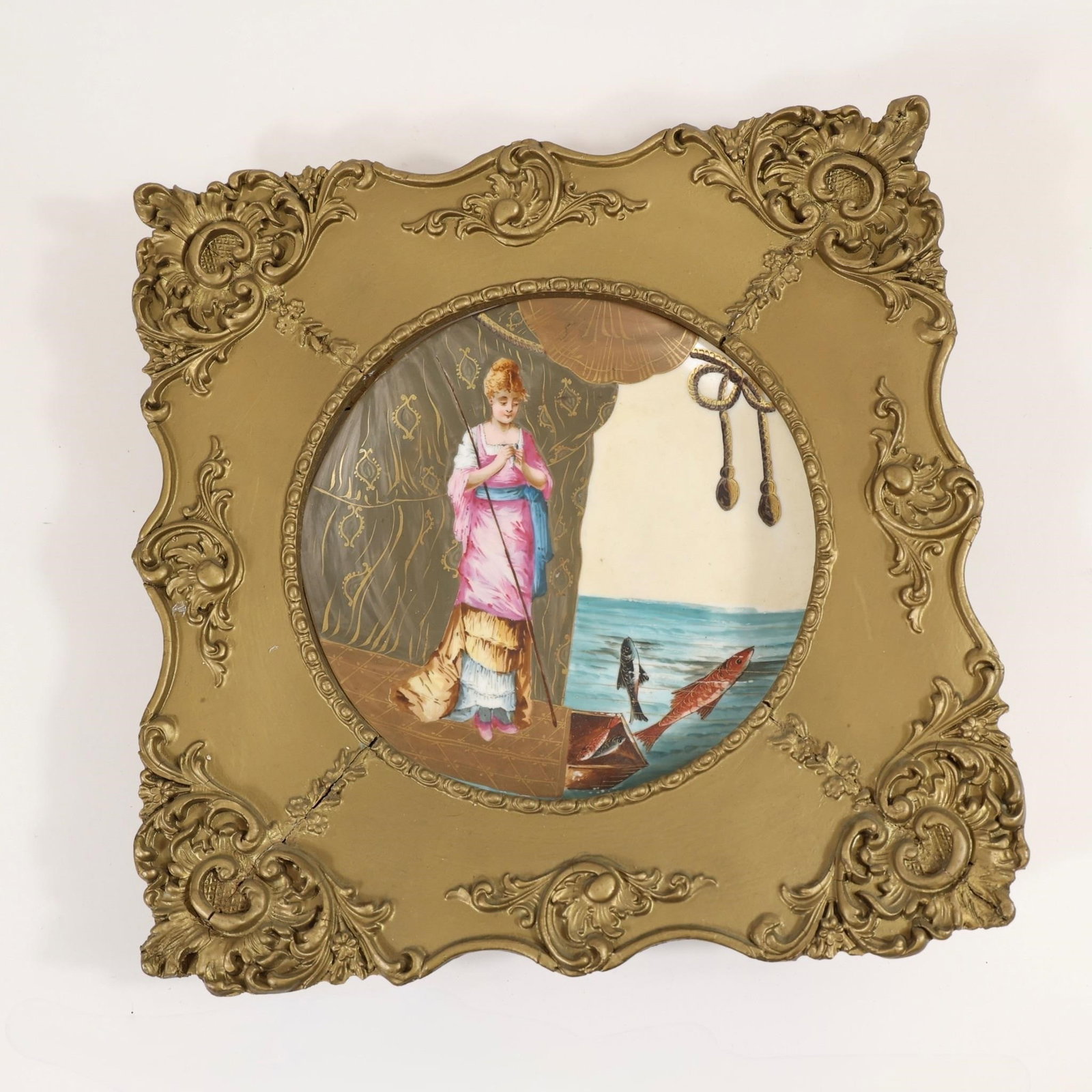 Porcelain Wall Plate w/ Rococo Frame: This image shows a decorative porcelain wall plate set within an ornate, gold-finished rococo-style frame.