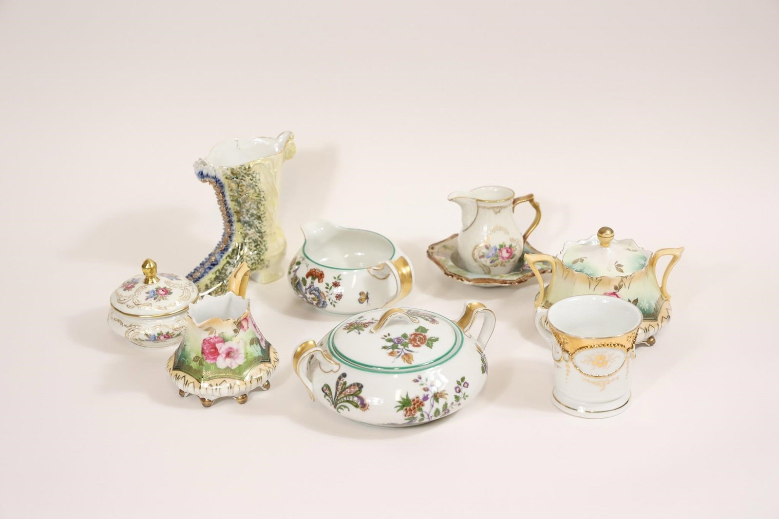 Antique Limoges Porcelain Sugar & Creamer Set: Elegant antique porcelain sugar bowls and creamers including examples by Haviland & Co., produced in Limoges, France, circa 1890-1930, along with pieces attributed to Rosenthal and RS Prussia; fine