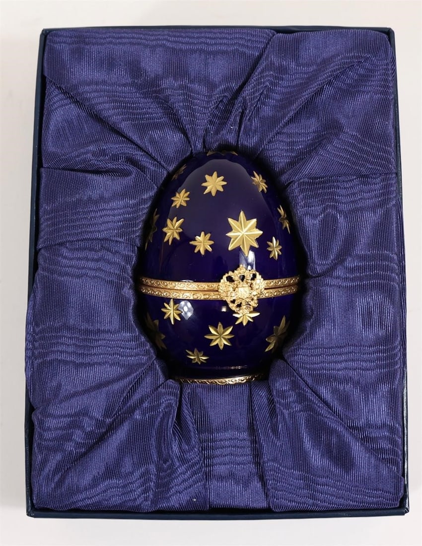 Fabergé Limoges Egg w/ Certificate: Fabergé Limoges porcelain egg featuring a hand-painted "Statue of Liberty" design, accompanied by official certificate card with serial number.