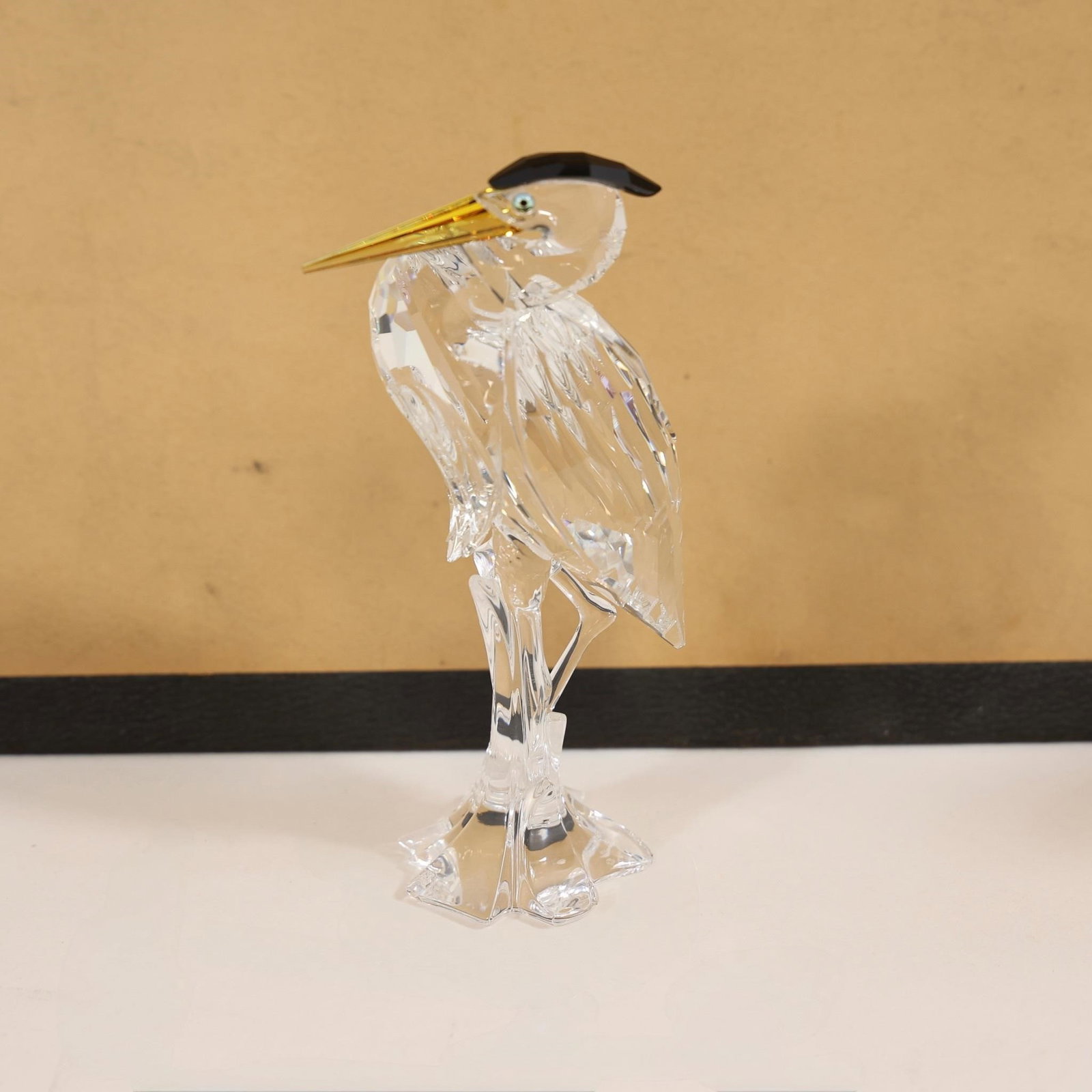Swarovski Silver Heron Figurine: This collectible item is a Swarovski Crystal Silver Heron figurine (model #221627).