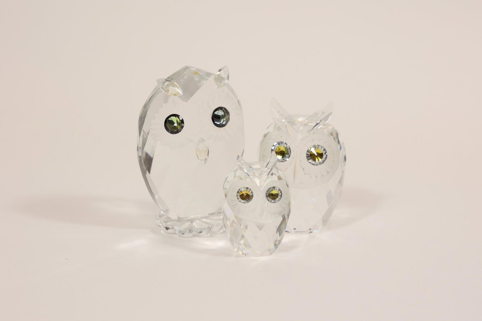 Swarovski Crystal Owl Couple Woodland Friends Set: Collectible Swarovski crystal owl figurines from the "Woodland Friends" collection, featuring a charming owl couple with small and large owls; expertly crafted with precision-cut crystal and fine