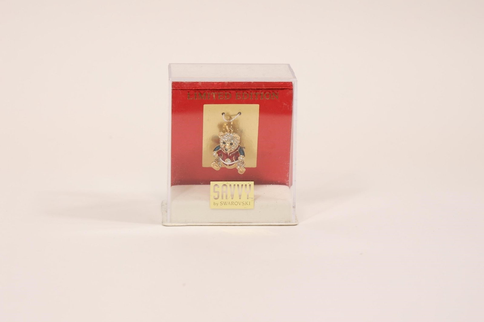 Vintage Savvy Swarovski Enamel Bear in Box: Vintage limited edition Savvy Swarovski enamel bear figurine featuring painted enamel clothing and sparkling Swarovski crystal accents; housed in its original display box, a charming and collectible