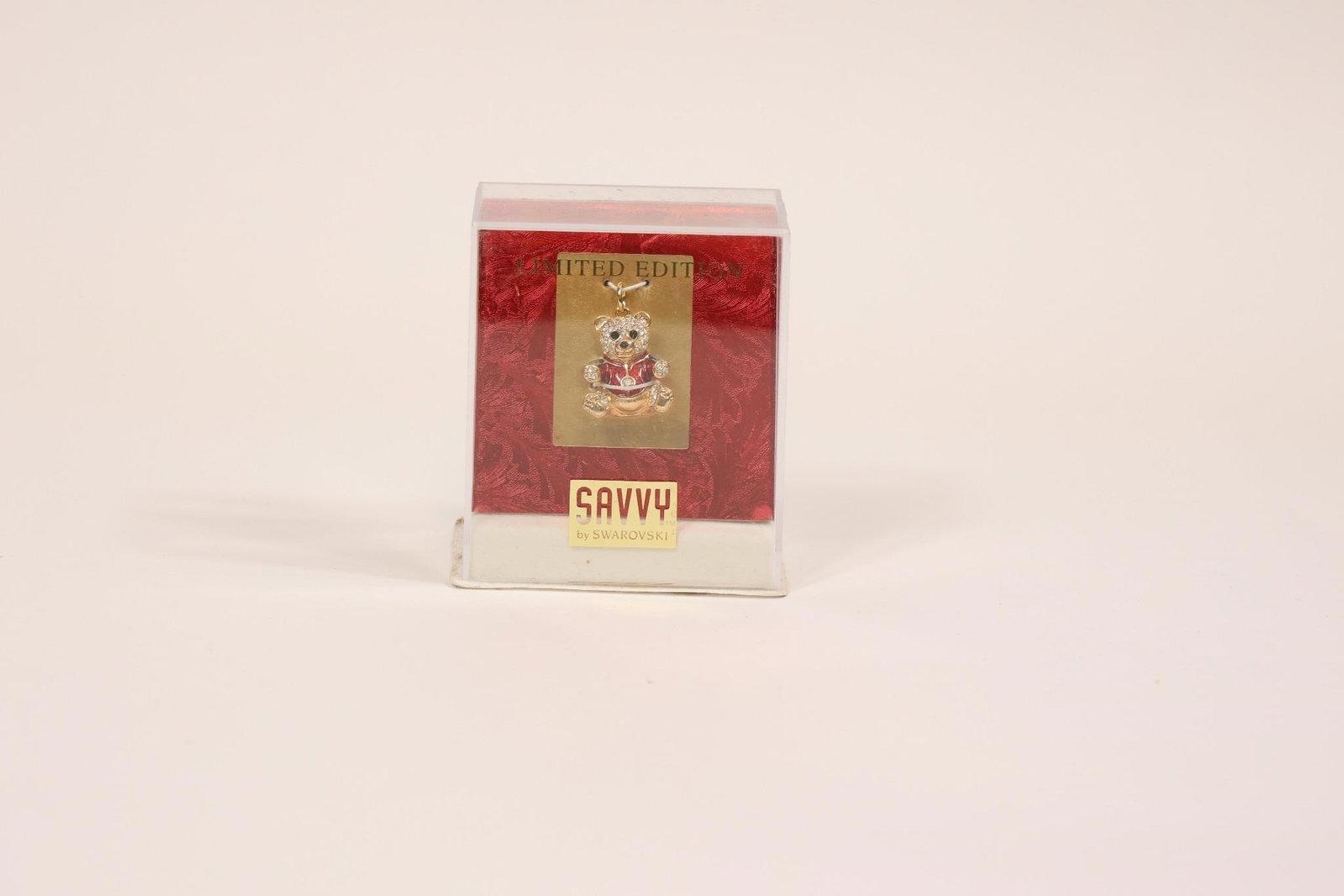 Vintage Savvy Swarovski Enamel Bear Charm: Vintage limited edition Savvy Swarovski enamel bear charm featuring detailed enamel work and sparkling crystal accents; a charming collectible jewelry piece with decorative appeal.