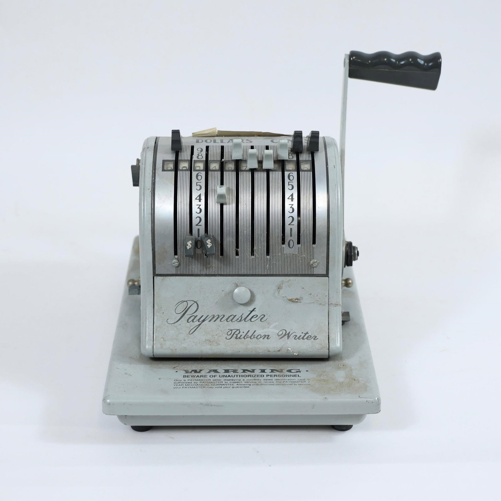 Vintage Paymaster Ribbon Writer: This vintage Paymaster Ribbon Writer check printer is a classic manual check-writing machine designed to securely fill out checks by imprinting the amount onto the check with ink. Built for durability