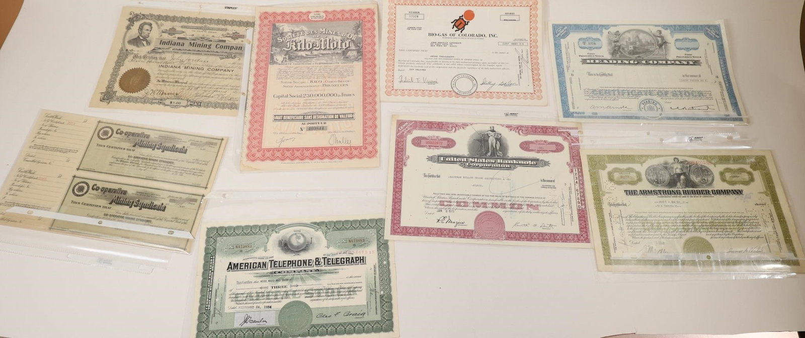 Vintage Stock Certificate Collection: Collection of vintage stock certificates and financial securities featuring American Telephone & Telegraph (AT&T), Indiana Mining Company, Eastern States Corporation, Armstrong Rubber Company,