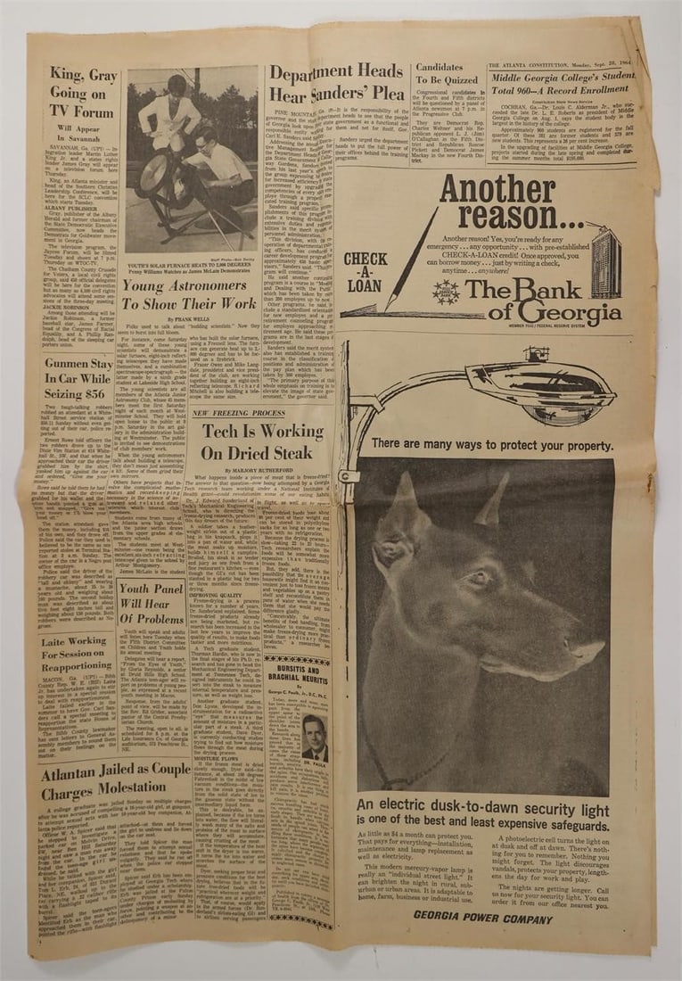 Atlanta Constitution Warren Report 1964: Pages from The Atlanta Constitution featuring the headline "THE WARREN REPORT: 'Oswald Not a Part of any Conspiracy, Domestic or Foreign'." Includes multiple news articles and photographs, along with