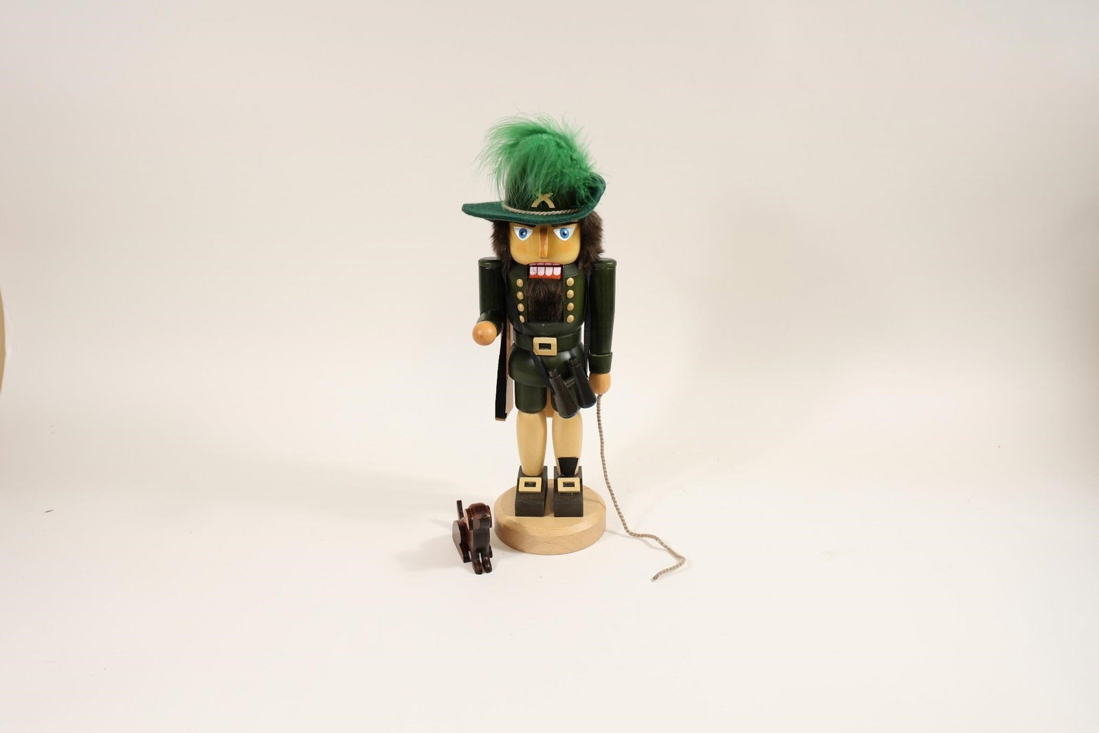 KWO German Nutcracker Hunter Figurine: Handcrafted KWO Nutcracker Hunter, a traditional wooden figurine made in Germany; features detailed craftsmanship and classic design, making it a charming collectible and decorative piece.
