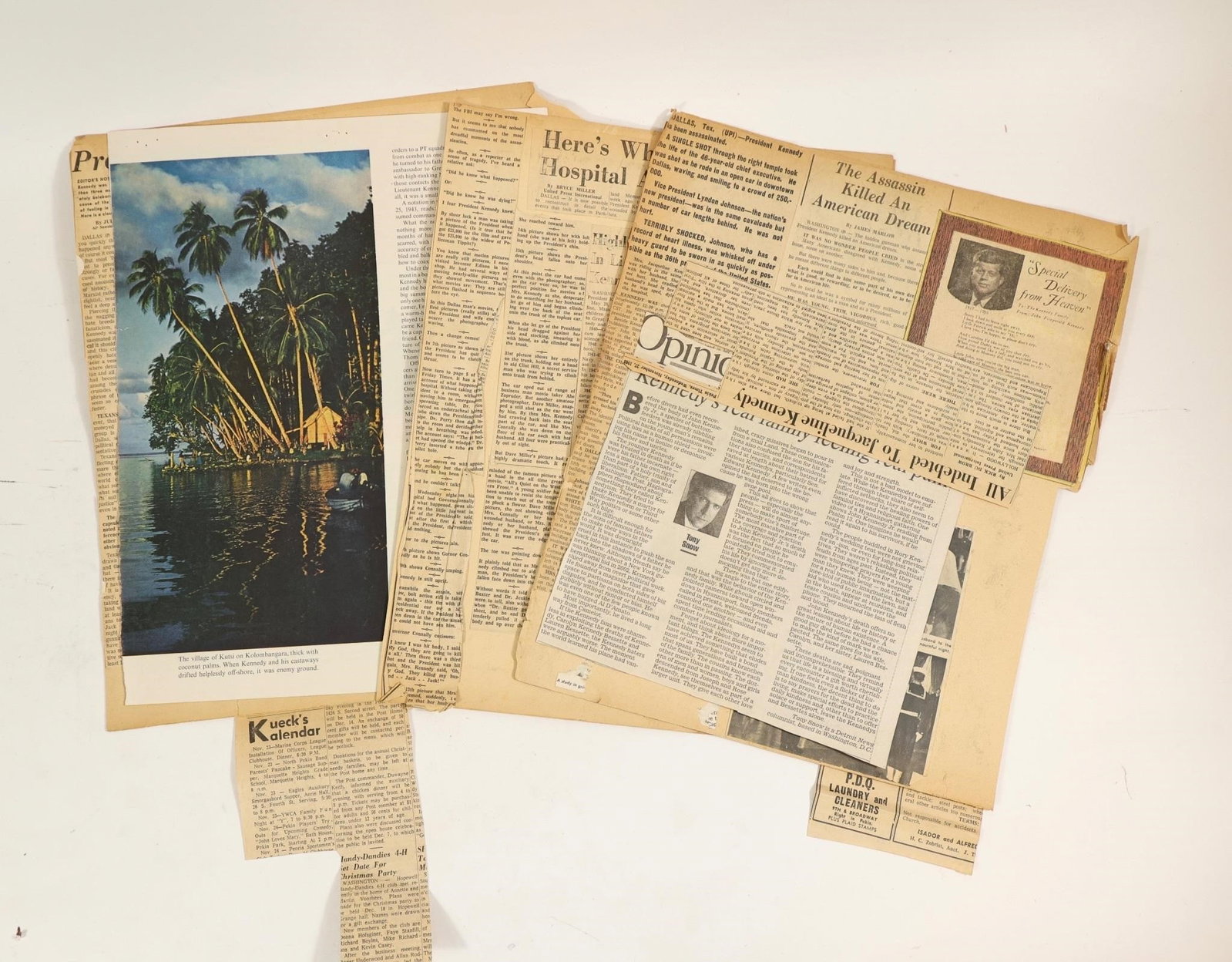 JFK Assassination Newspaper Clippings Articles: Collection of vintage newspaper clippings and articles related to the assassination of President John F. Kennedy in 1963. The lot includes historic headlines, opinion pieces, and period reporting