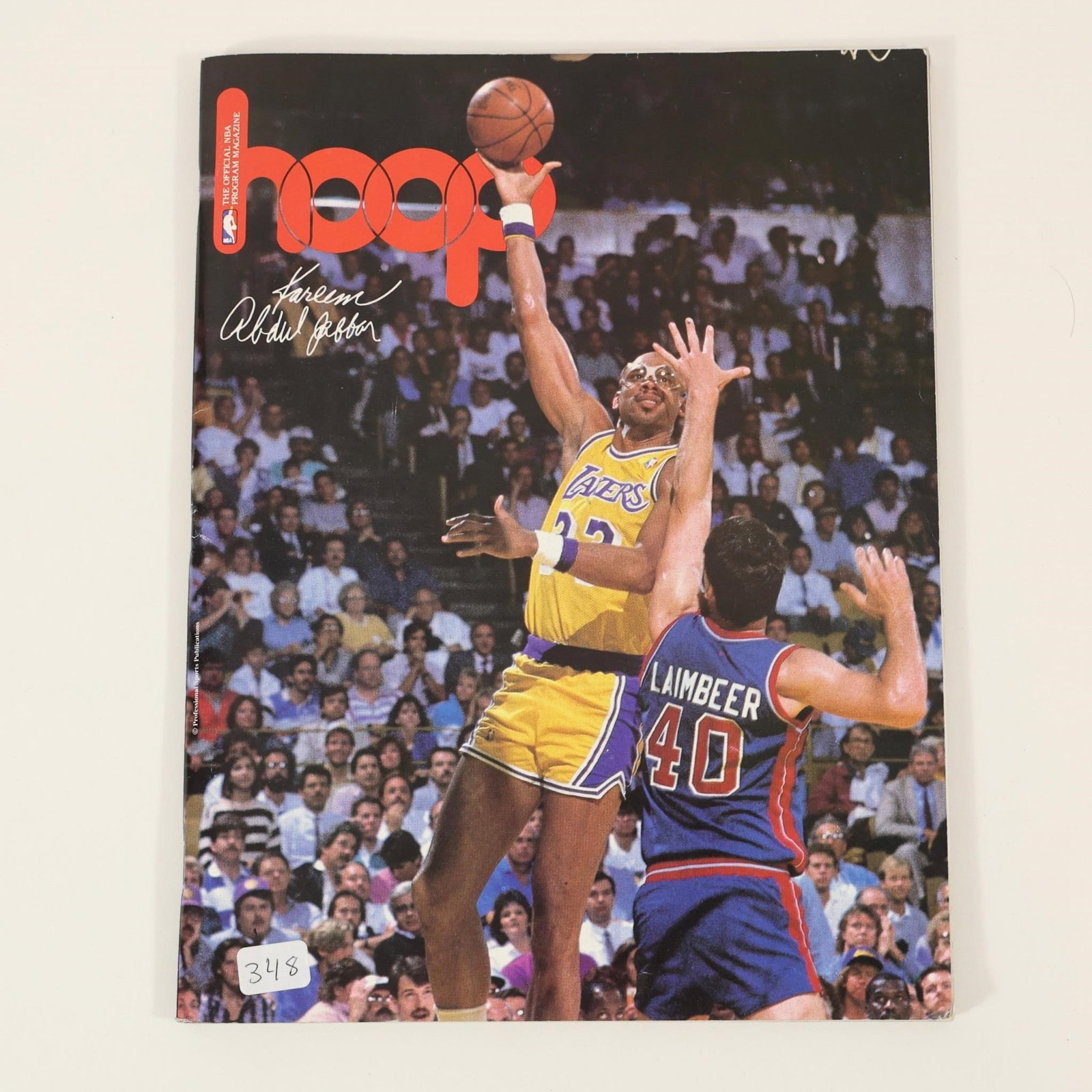 Kareem Abdul-Jabbar Signed HOOP Magazine Cover: Signed HOOP magazine featuring Kareem Abdul-Jabbar on the cover in his Los Angeles Lakers uniform. Signature appears in silver ink on the front cover. Presents well and would make a great addition to 