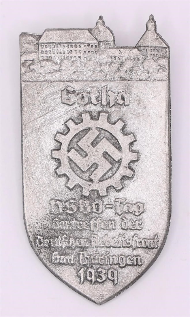 1939 Gotha NSBO Day Badge German Tinnie Pin: l 1939 Gotha NSBO Day badge (tinnie) issued for a factory cell organization meeting in Gotha, Germany. Metal souvenir pin featuring period design associated with the National Socialist Factory Cell Or