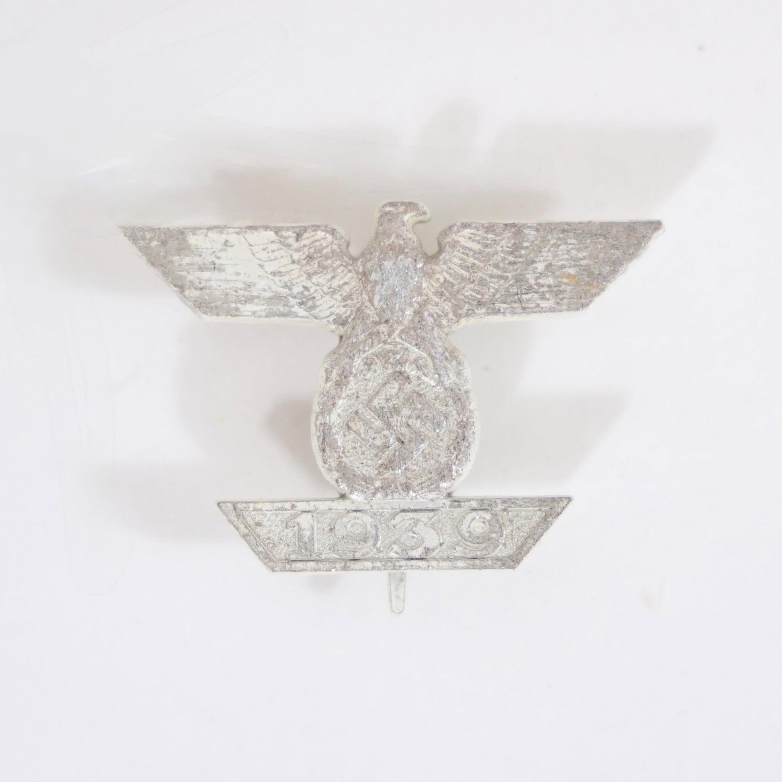 WWII German Iron Cross 1st Class Clasp: German WWII 1st Class Clasp to the Iron Cross featuring a national eagle clutching a swastika above a trapezoid bar inscribed "1939", worn above the 1914 Iron Cross by recipients re-awarded during WWI