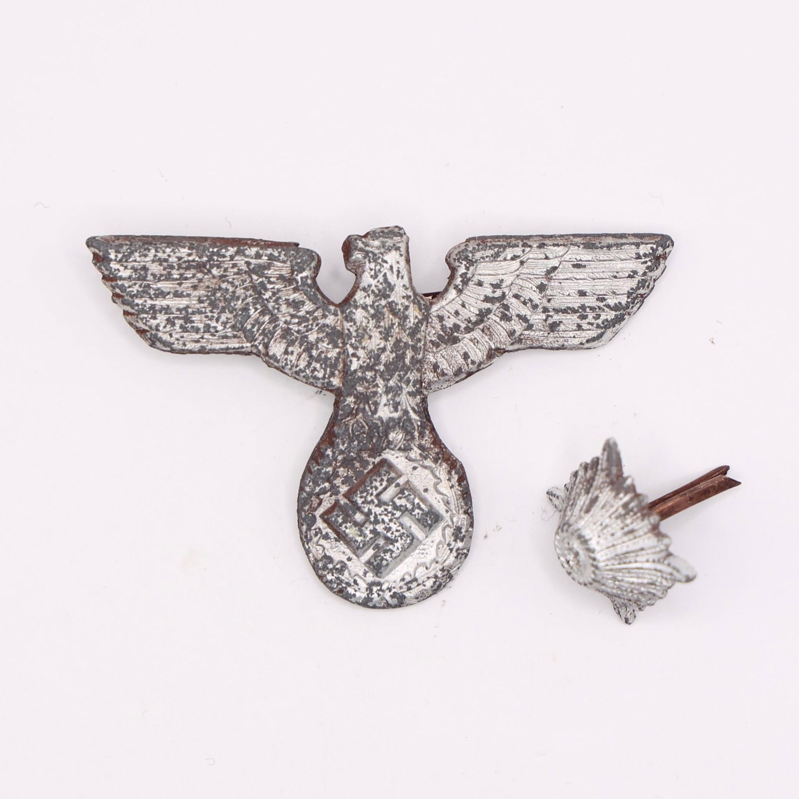 German NSKOV Badge & Wehrmacht Rank Star: German Third Reich NSKOV (National Socialist War Victim's Care) badge and original WWII Wehrmacht soldier metal rank star pip, both metal, pin-backed, typical period designs, good condition; sold