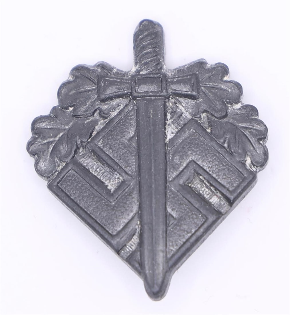 NSKOV Donation Pin (WWII Era): A small aluminum lapel pin issued by the NSKOV, an organization that supported wounded German veterans. The front shows a sword laid over a swastika with oak leaves around the upper portion. The