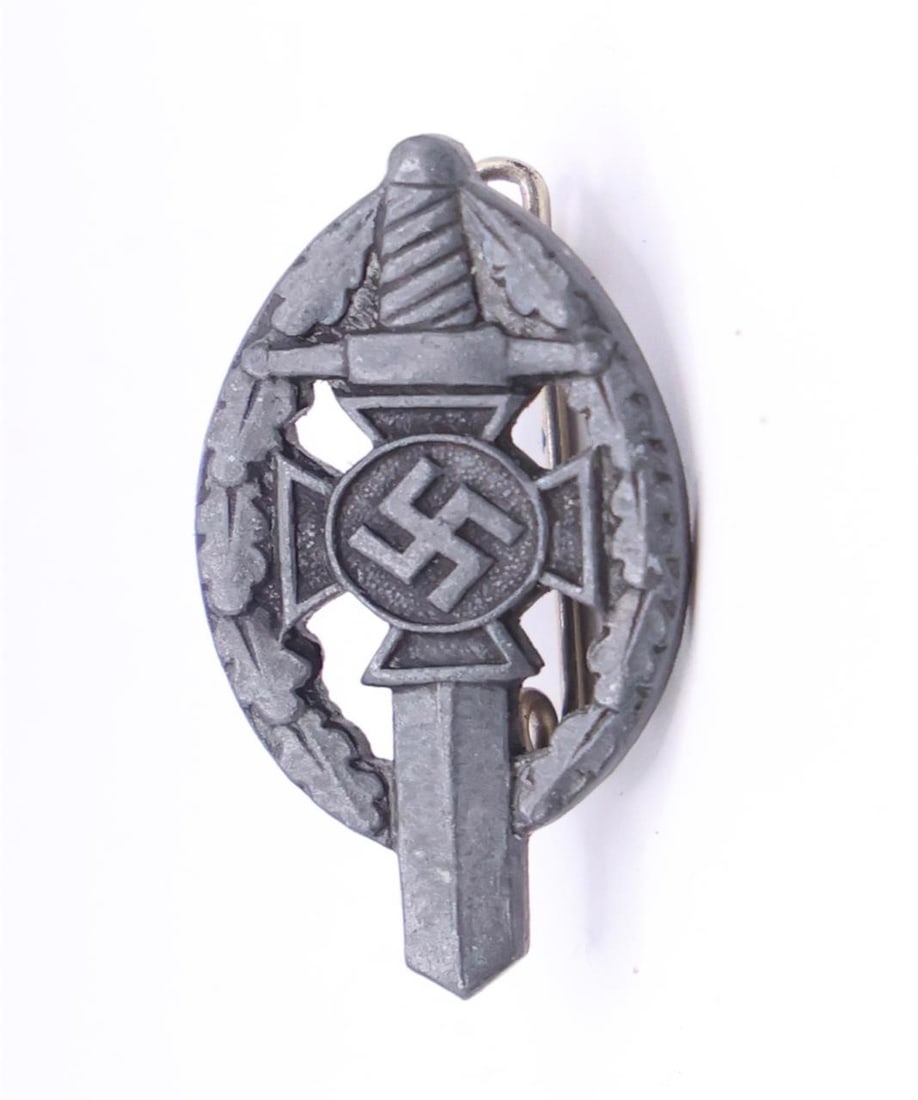Germany III Reich NSKOV Badge: German Third Reich NSKOV (National Socialist War Victim's Care) badge, metal construction with pin back, typical period design, good condition.