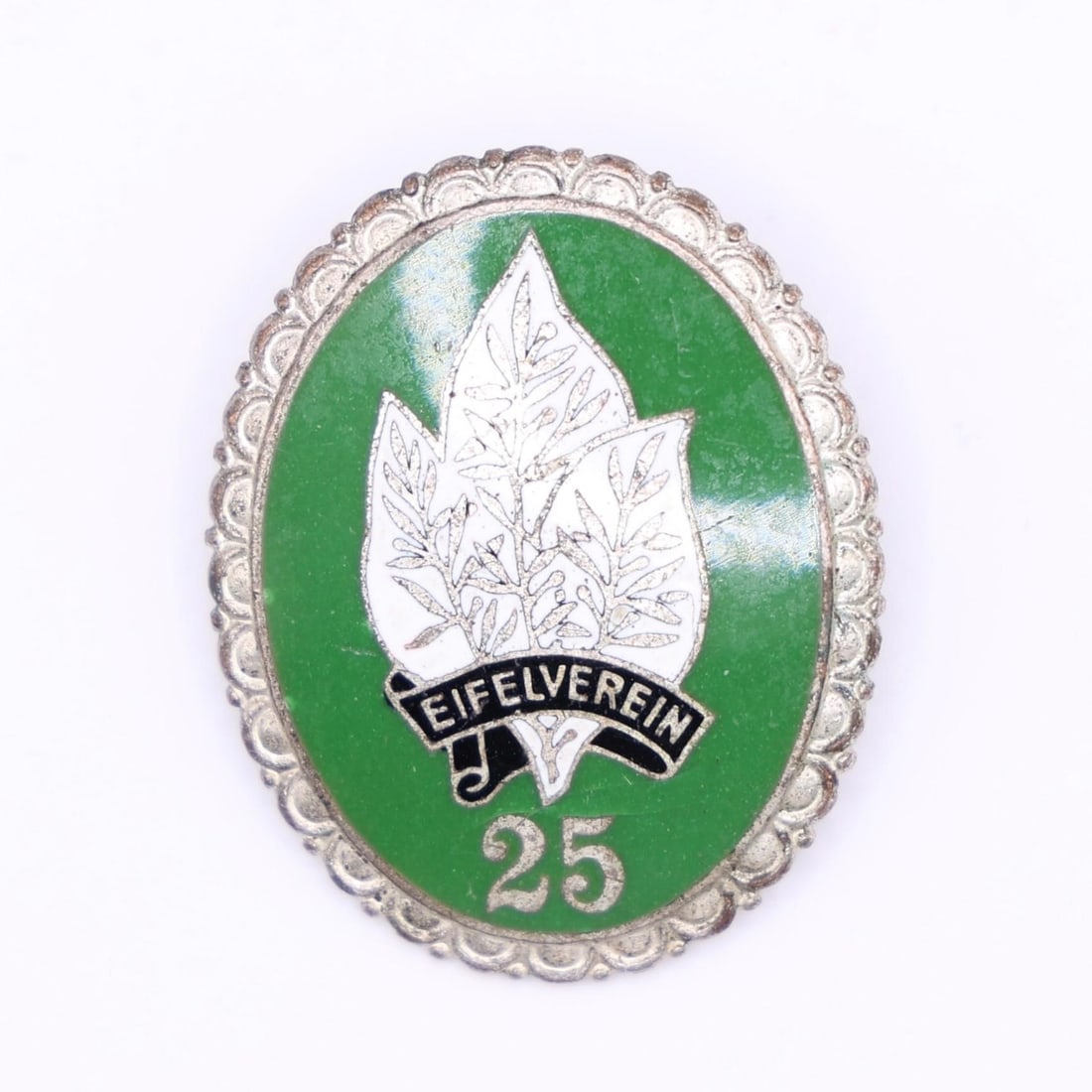 Eifelverein 25-Year Membership Badge: This is a 25-year service badge from the Eifelverein, a long-established German hiking and nature-preservation organization founded in 1888. The front shows a green enamel field with a white multi-lea