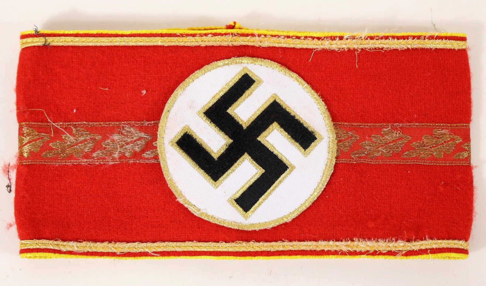 NSDAP Armband: NSDAP armband with gold embroidery, which was historically used by high-ranking political leaders of the Nazi party.