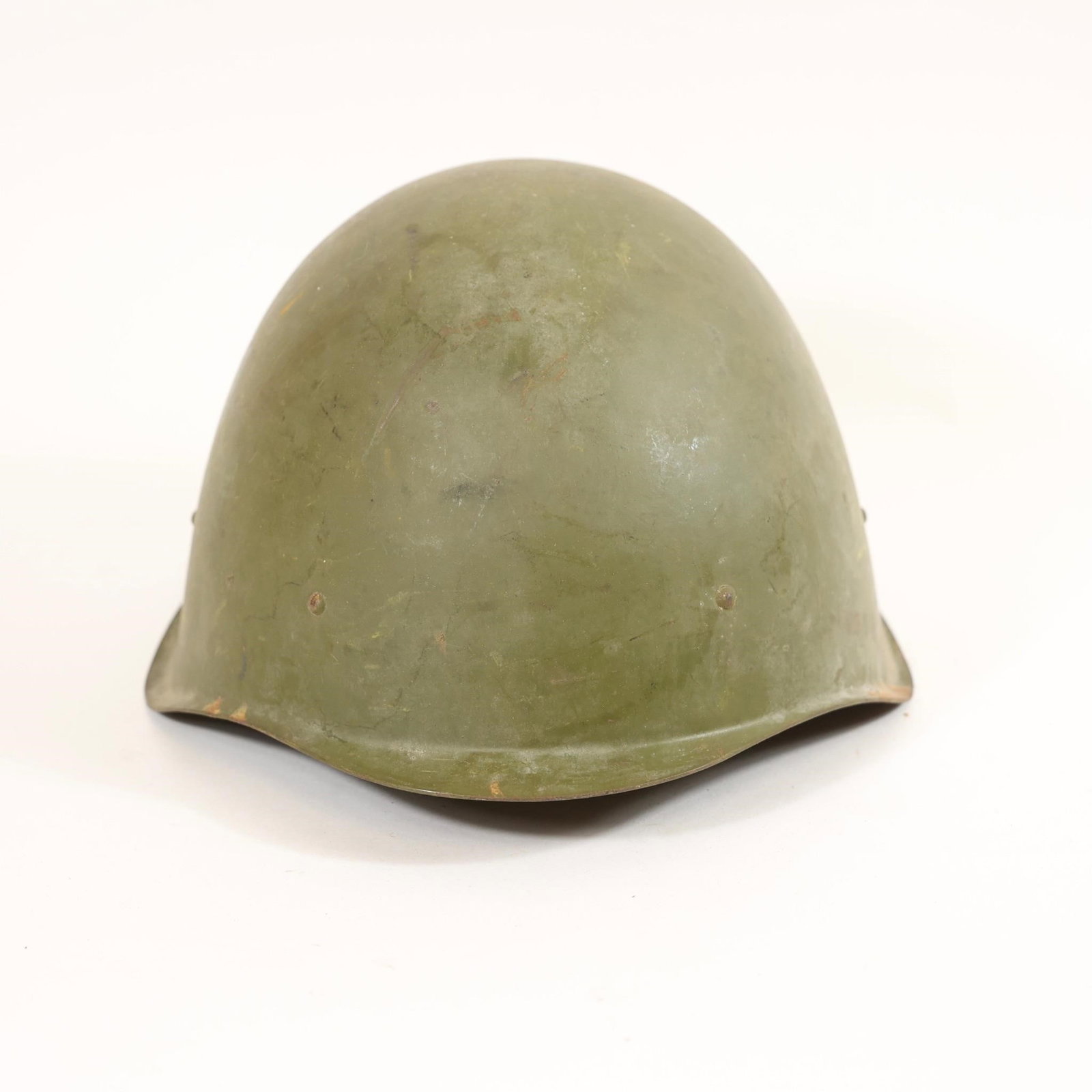 1948 Soviet SSh-40 Helmet: Soviet SSh-40 steel helmet featuring its original factory stamp with the 1948 production date. Finished in classic olive green, this post-war example retains the distinctive SSh-40 design and
