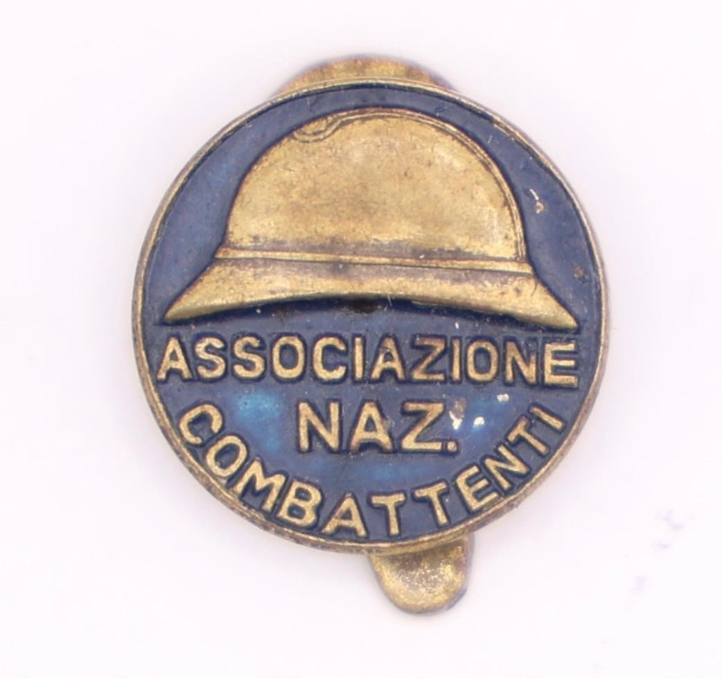 Italian Combattenti Veterans Badge: Italian Associazione Nazionale Combattenti (National Association of Combatants) badge from the interwar period between WWI and WWII. The design features a military helmet above the inscription