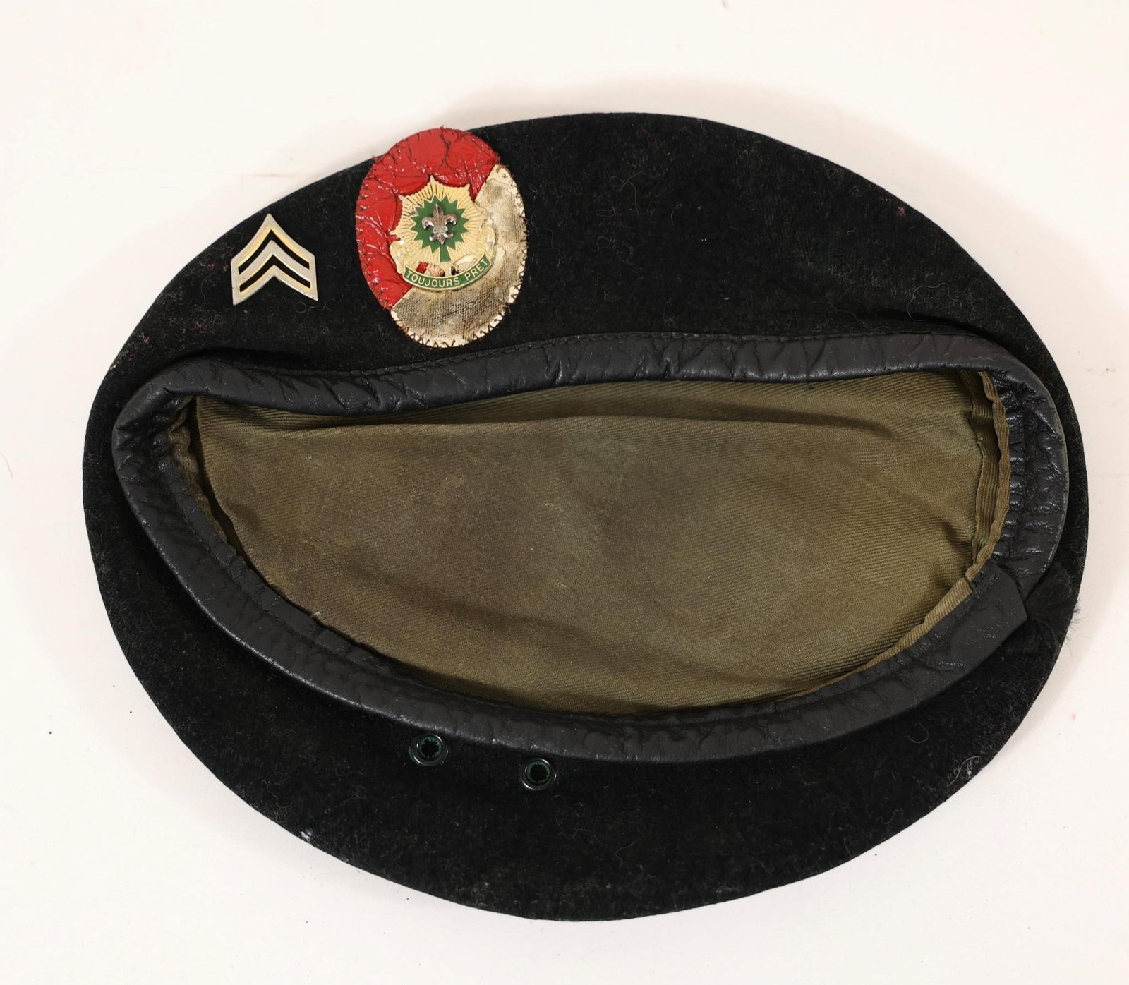 Corporal's Black Beret: A black military-style beret featuring a corporal's chevron patch and a cavalry-style insignia badge inspired by the 2nd Armored Cavalry Regiment. The combination of rank and regimental symbols gives