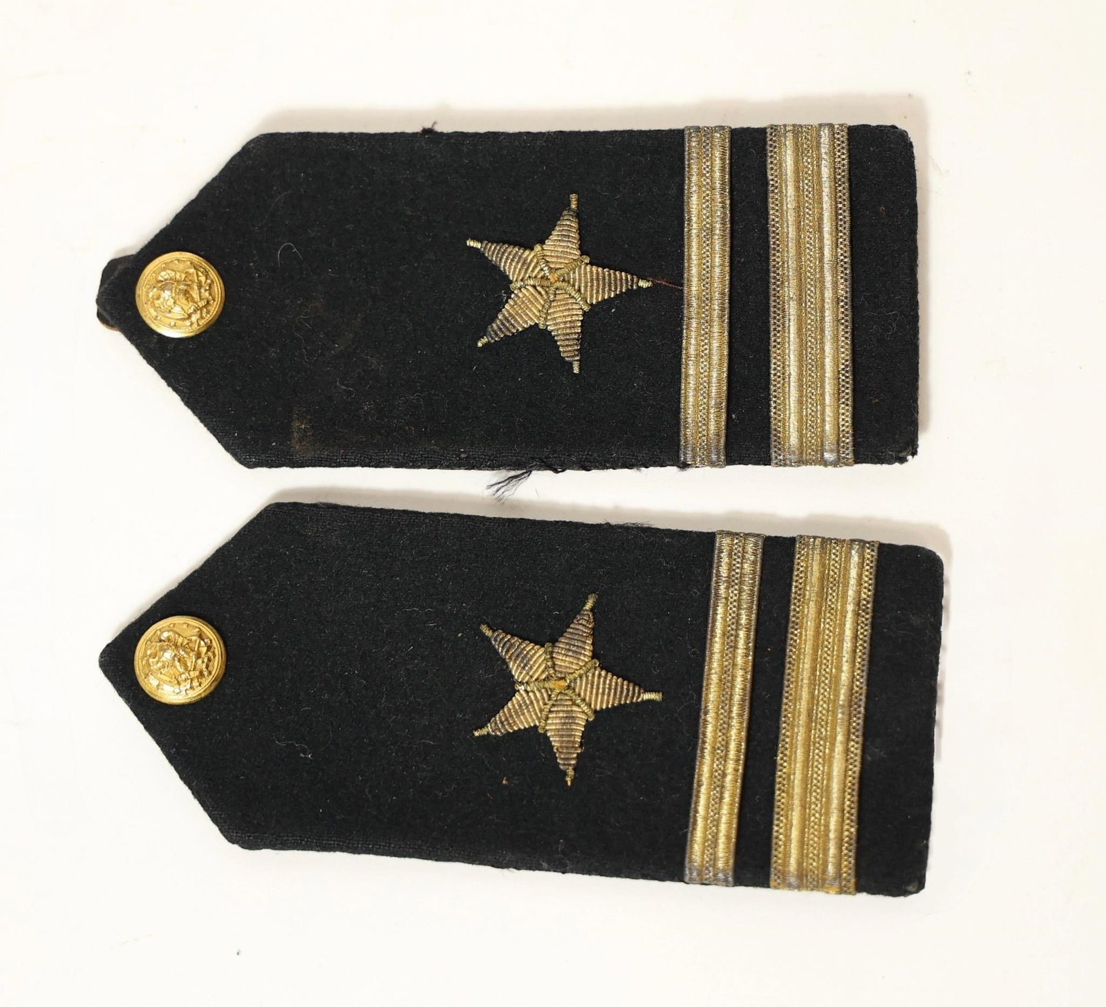 US Navy Officer Rank Lieutenant Jr Shoulder Board: These are United States Navy line officer's hard shoulder boards. The black wool fabric and gold trim denote a Navy officer's uniform insignia. The single embroidered star indicates a "line officer"