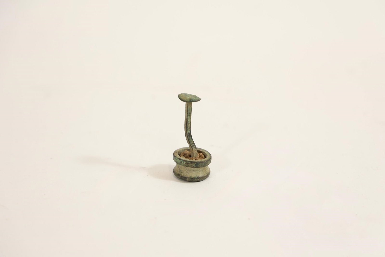 Civil War Brass Tampion Marked "C-47": Civil War brass tampion with engraved unit/company marking "C-47" on top. Used to fit in gun muzzles when troops were on the march. Part of cork remains inside. Features dug green patina. Recovered