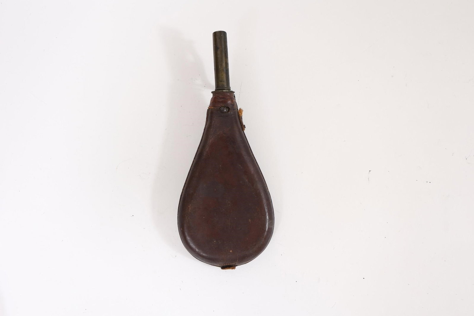Early Brass Powder Flasks: Early brass powder flasks, traditionally used for carrying gunpowder. Featuring embossed decorative designs and classic antique form. Likely 19th century examples with natural patina from age and