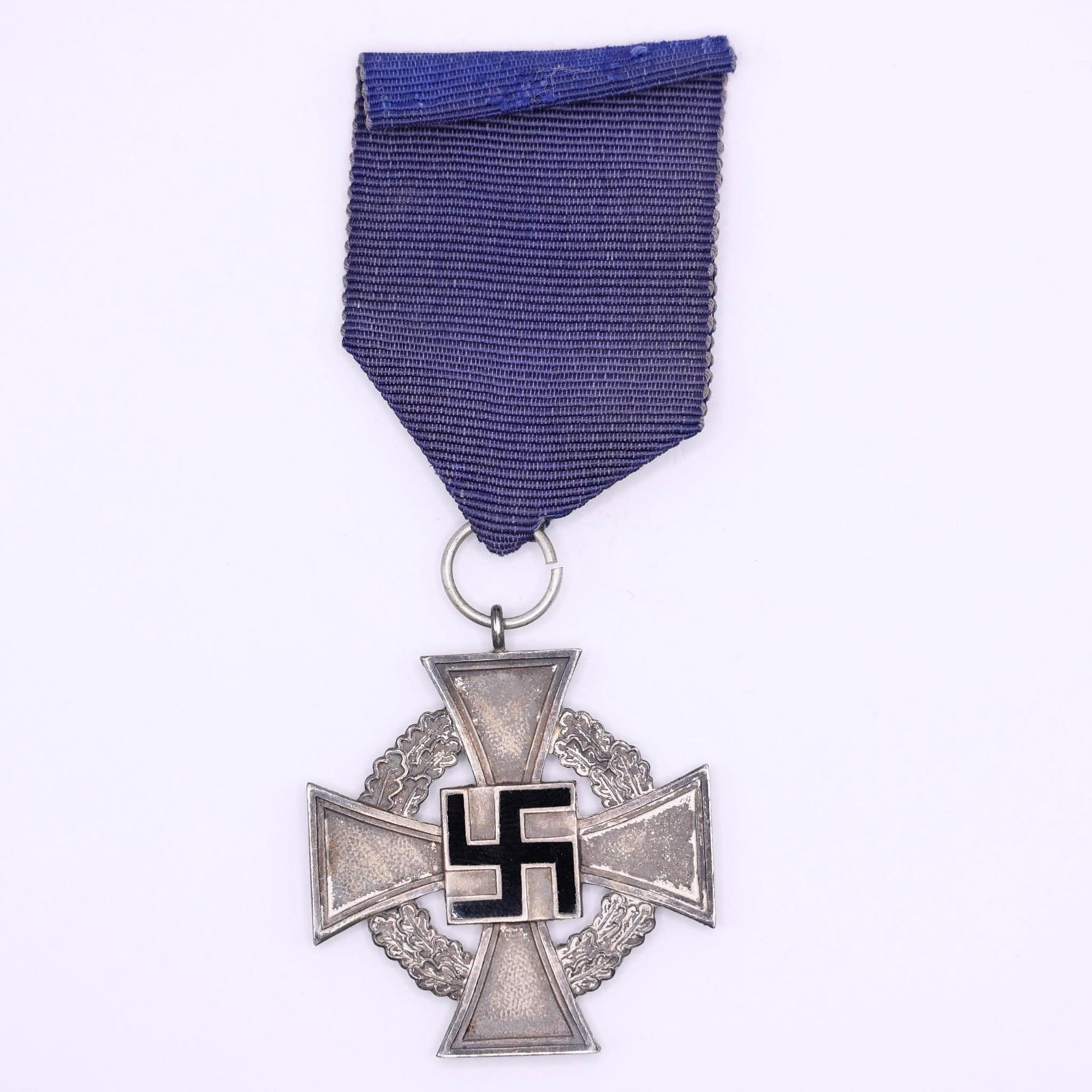 WWII German 25-Year Faithful Service Medal: WWII German 25-Year Faithful Service Medal, instituted on January 30, 1938, to honor civilian employees with at least 25 years of loyal service. The silver cross measures approximately 43 mm across,