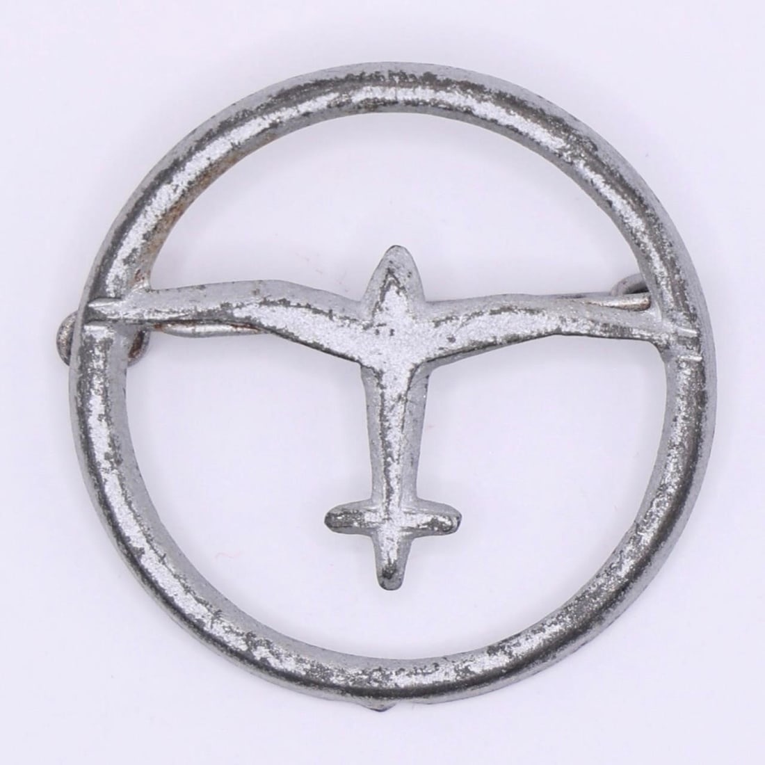 German Air Sports Association (DLV) Supporter Pin: A small metal tinnie showing a stylized aircraft inside a circular border. These pins were worn by supporters of the Deutscher Luftsportverband (DLV), the organization responsible for early pilot trai