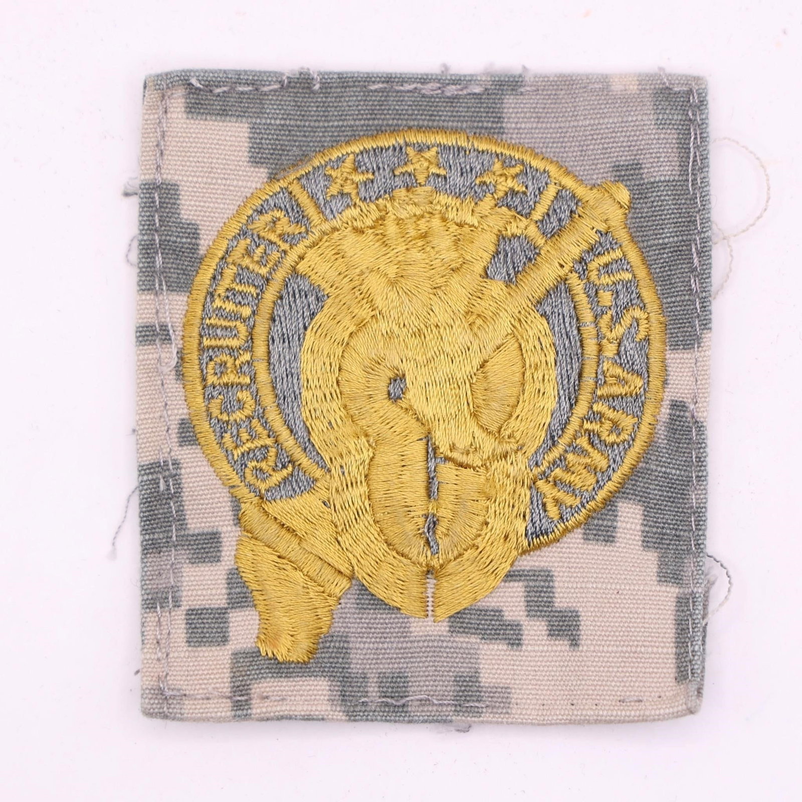 U.S. Army Recruiting Command patch: U.S. Army Recruiting Command patch, specifically designed for wear on the now-obsolete Army Combat Uniform (ACU) featuring the Universal Camouflage Pattern (UCP). The design features a