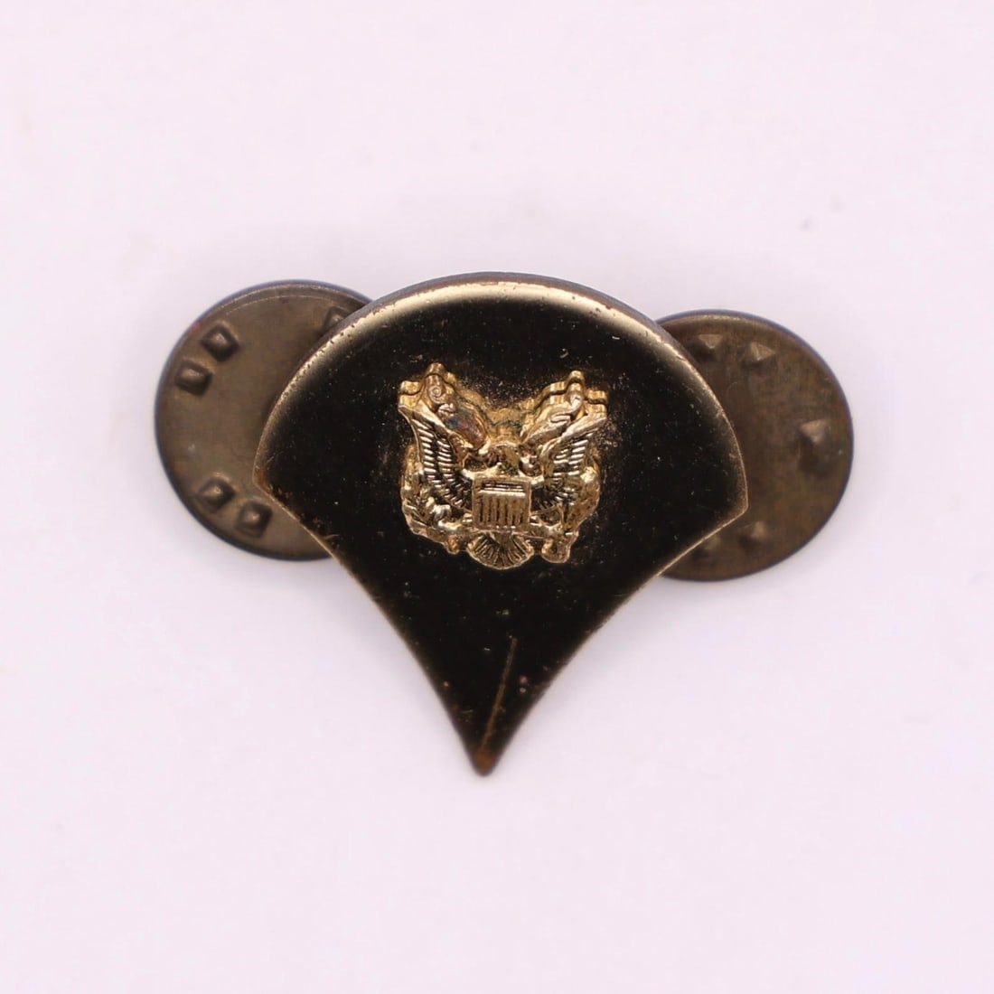 Vintage US Army Specialist E4 Rank Insignia Pin: This is a vintage US Army Specialist (E-4) rank insignia pin. It features an eagle device, which is the symbol for the Specialist rank in the US Army. The insignia is typically worn on the collars of 