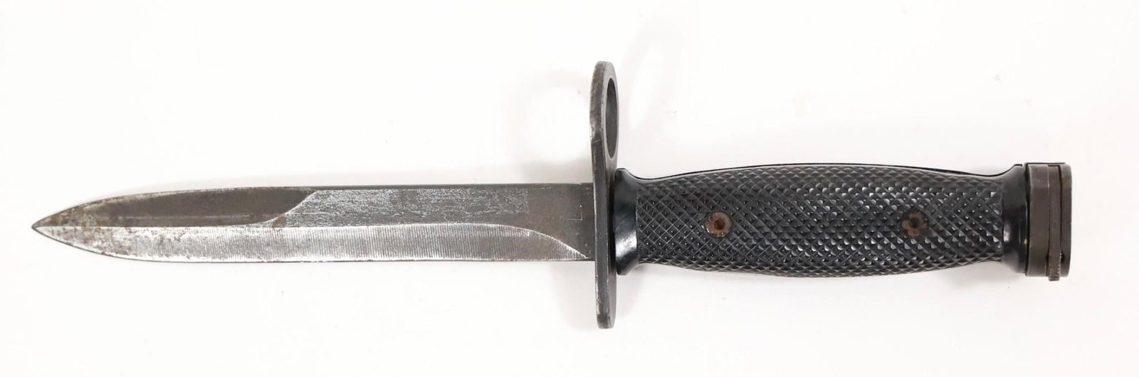 Vintage Vietnam Era U.S M7 Bayonet: Vintage Vietnam Era U.S M7 bayonet featuring a steel spear-point blade and a black textured grip with metal hardware. Includes a muzzle ring and solid steel guard, typical of classic military bayonet