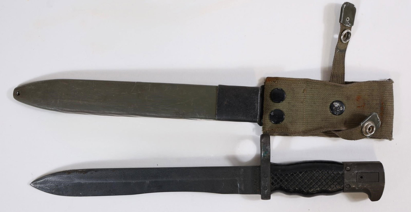 Spanish Military Bayonet w/ Scabbard: Spanish military bayonet with scabbard. Clean overall with light wear from use.Approx. OL: 13"BL: 9"