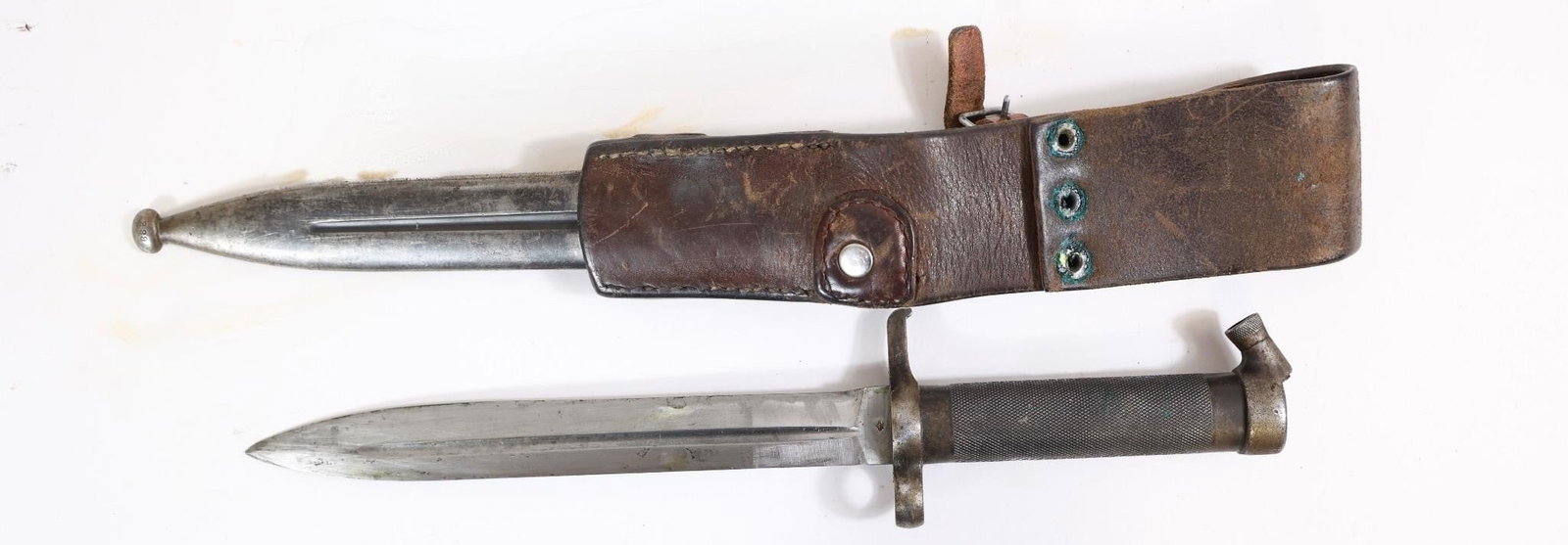 Swedish Military Bayonet w/ Scabbard: Swedish military bayonet with metal handle and blade, includes leather scabbard. Shows wear, patina, and age-related marks.OL: 13"BL: 8.5"