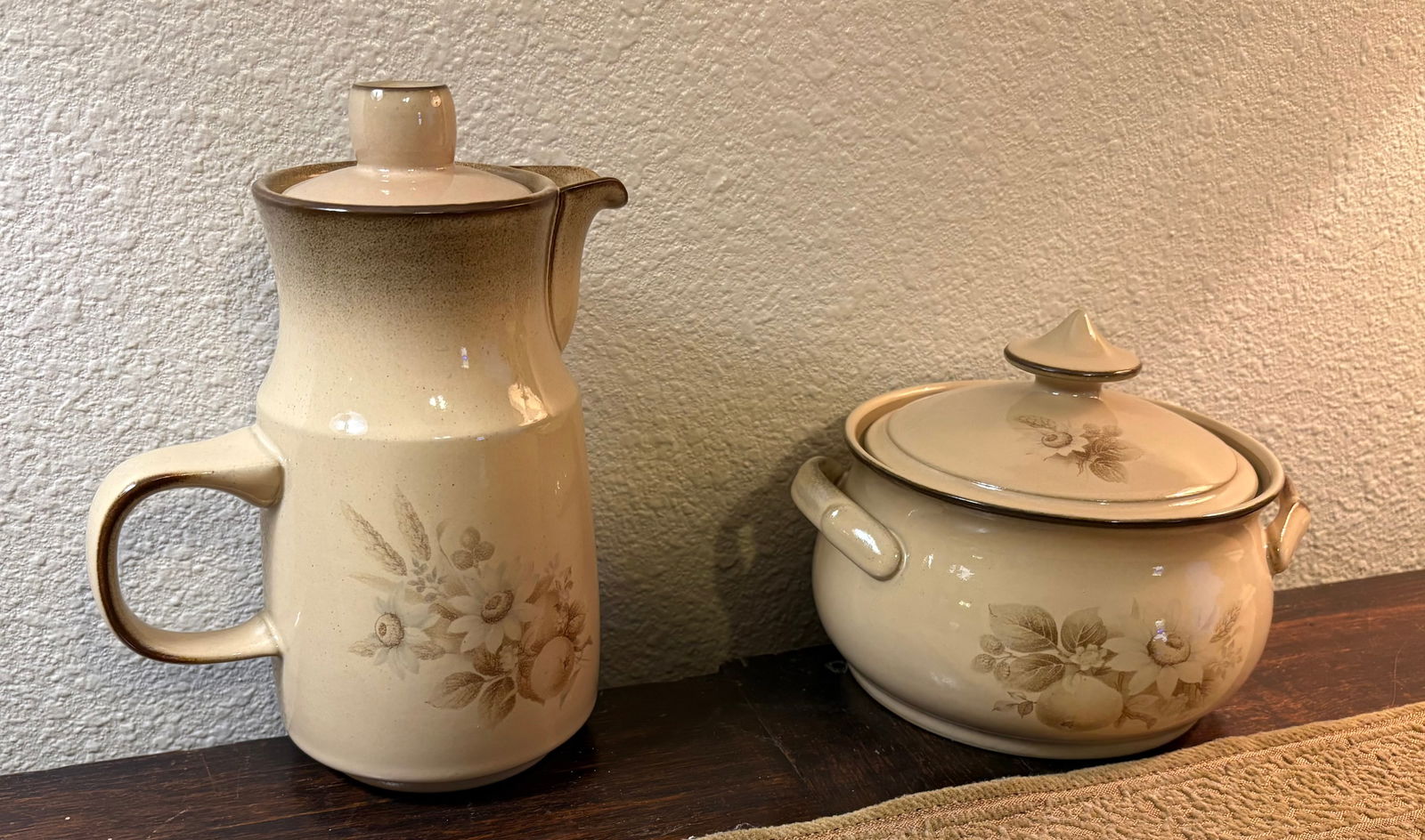 Vintage 1970s (Discontinued) Denby Coffee Pot & Vegetable Tureen: This lot features a pair of stoneware items from the discontinued Denby "Memories" stoneware collection. The collection was produced by Denby in England between 1979 and 1987.The pattern features a