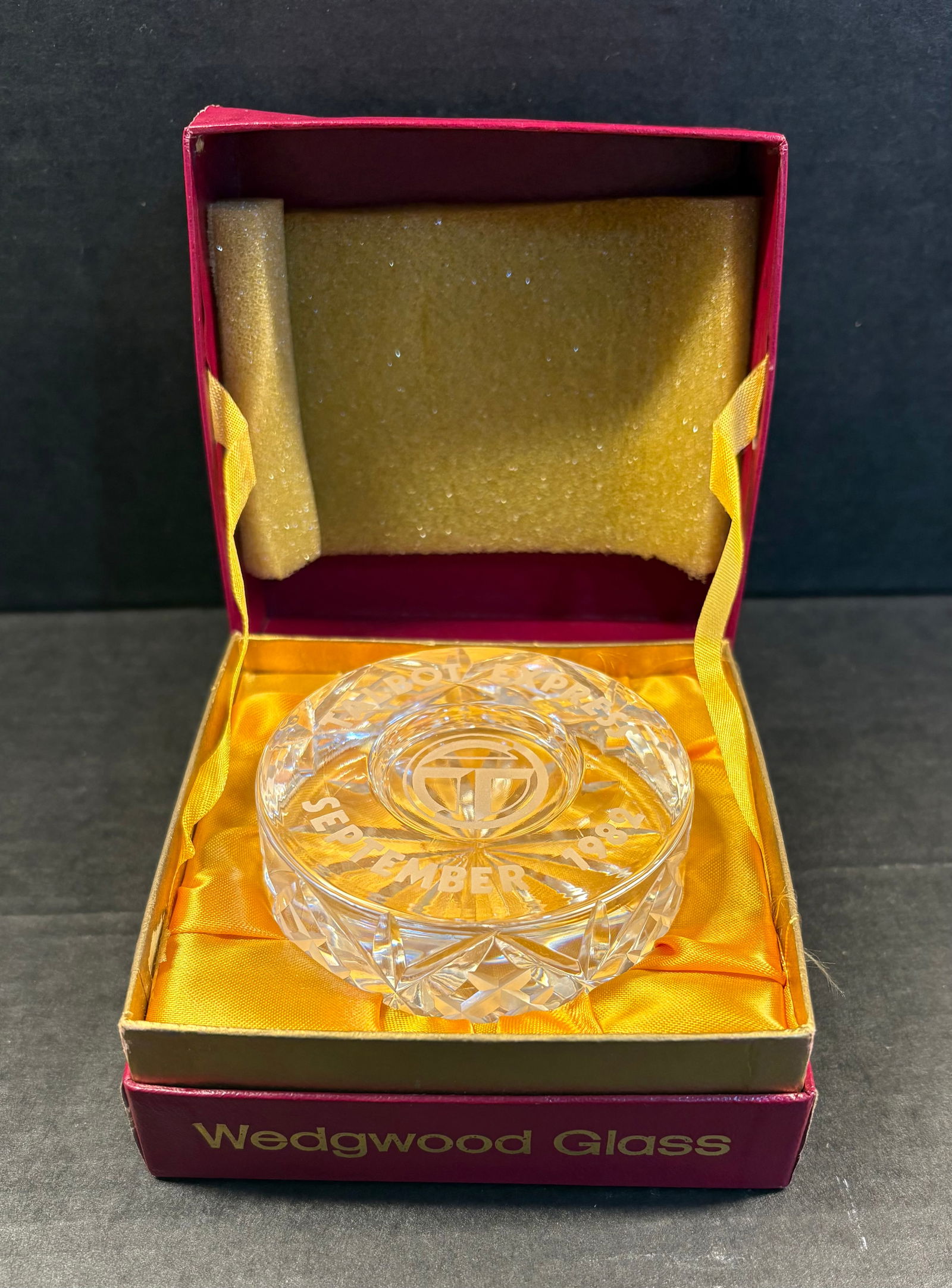 Vintage (1980s) Wedgewood Glass Crystal Paperweight w/Original Presentation Box: This lot features a vintage Wedgwood glass crystal paperweight. The text "September 1982" is engraved on the top surface, lower half of the crystal while "Talbot Express" is engraved on the upper half