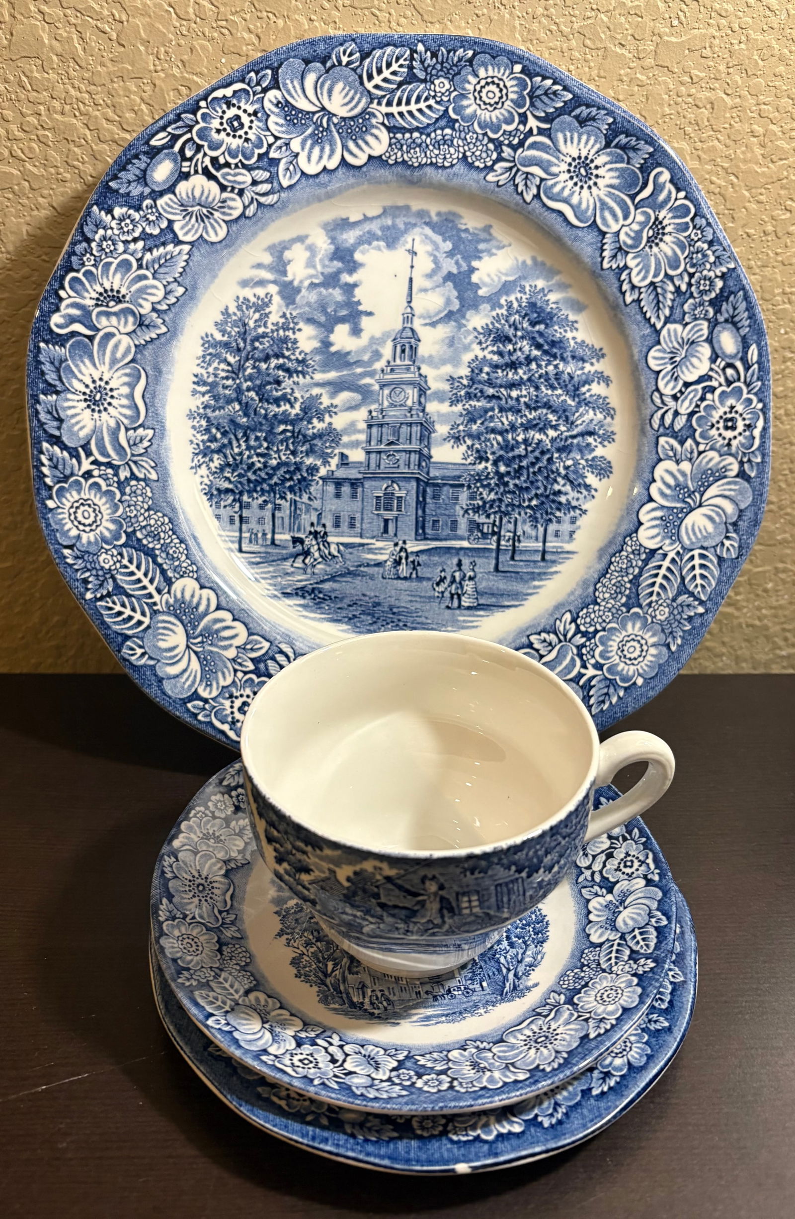 Vintage 4-Piece Place Setting of Liberty Blue Collection - Made in England: This lot features a 4-piece place setting from the Liberty Blue collection, a classic transferware pattern produced by Staffordshire in England...made of Ironstone (now discontinued). The pattern feat
