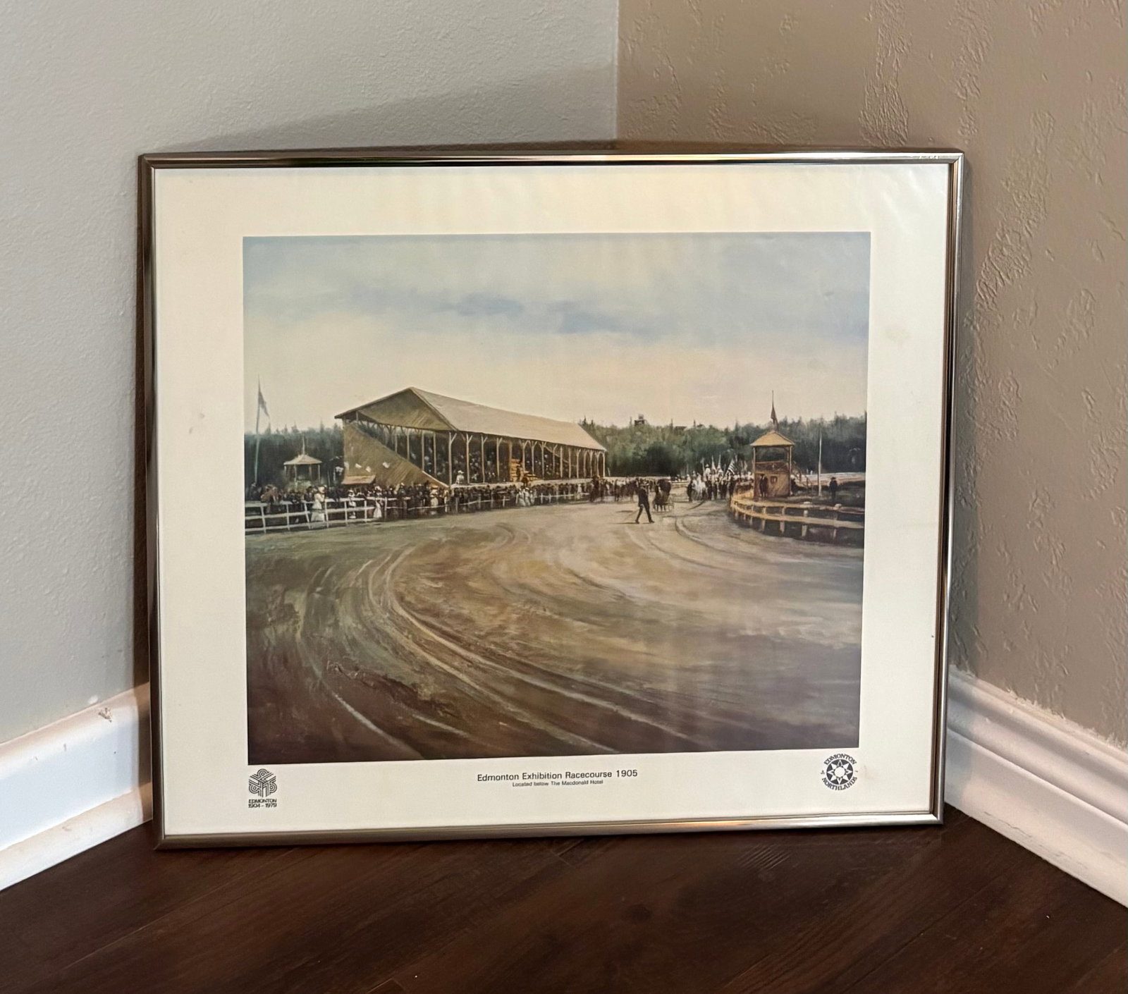 Vintage Framed Print of Edmonton Exhibition Racecourse in 1905: This framed print depicts the Edmonton Exhibition Racecourse in 1905, which was located below the Macdonald Hotel. It is a commemorative piece issued by Edmonton Northlands to mark the period from 190
