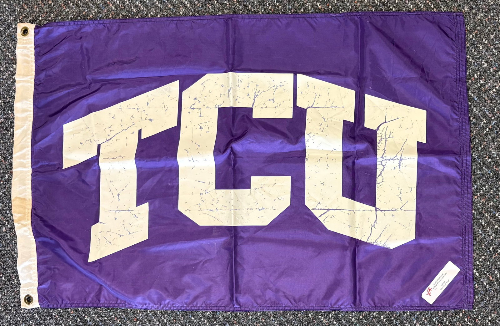 Texas Christian University (TCU) Horned Frogs "Pre-Big12 Flag w/Brass Grommets.: Texas Christian University (TCU) Horned Frogs polyester flag with brass grommets.The flag features a purple field with a bold, white "TCU" arched logo. Made from 100% polyester with a canvas heading a