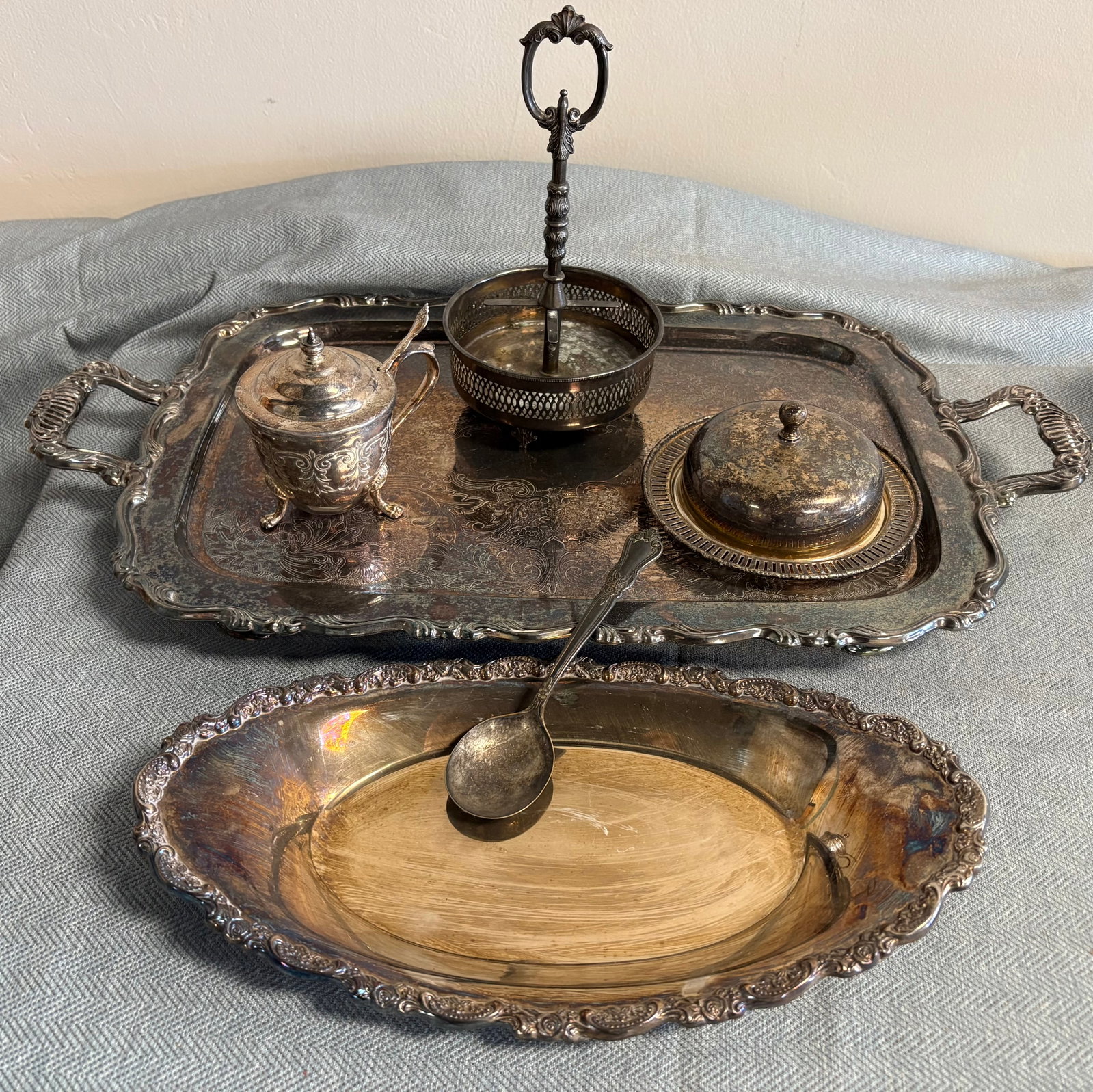 Vintage 10-Piece Silver-Plated Service Set Collection: This vintage 10-piece collection of a silver-plated service set includes, a large, double-handled tray, a lidded sugar bowl (or honey pot) with a spoon, a butter dish, a handled condiment carrier, and