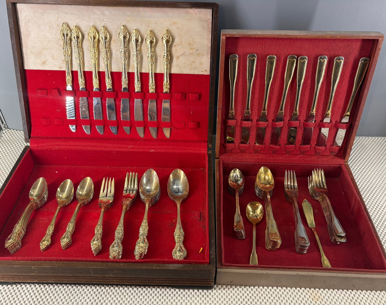 Vintage (MCM) Japanese Golden Barclay & IBW Cutlery w/Wooden Box Cases: This lot features to wooden boxes with differing cutlery pieces. All pieces are gold-toned and they are both from Japanese origins. All pieces may not be present. One set is branded IBW while the othe